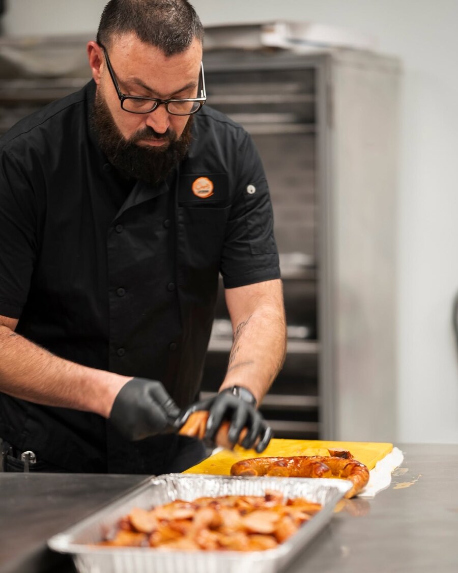 A Chef's Catering chef preparing food in the kitchen