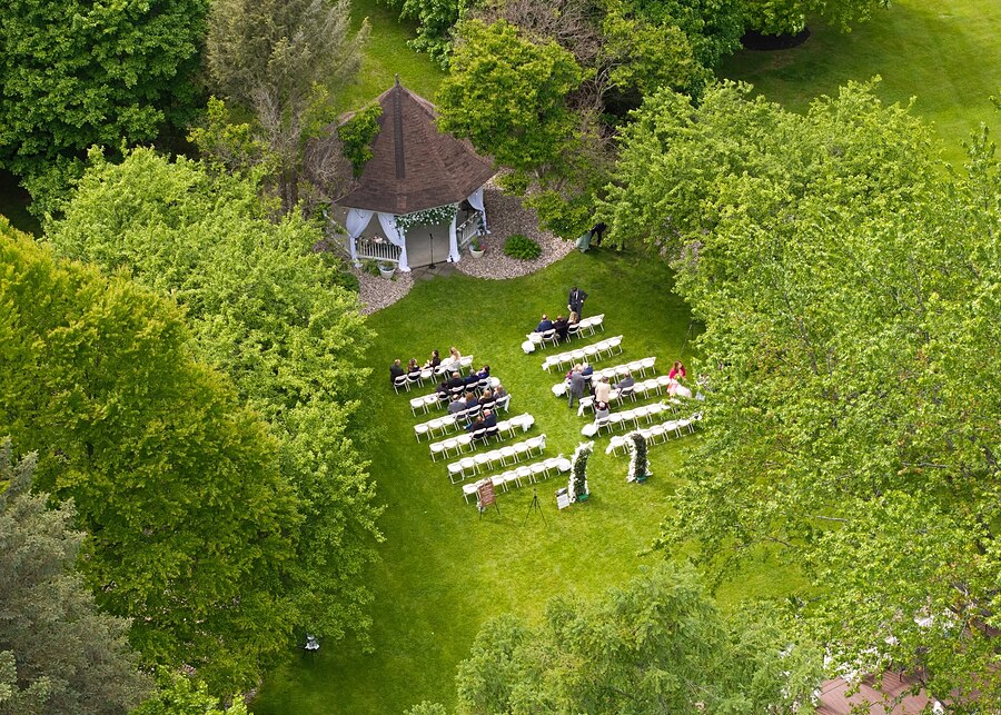 Aerial view of a wedding ceremony set up on the grounds near Rochester, NY