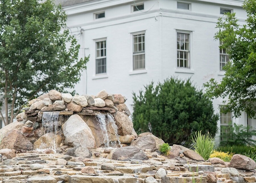 The stone waterfall in front of the house