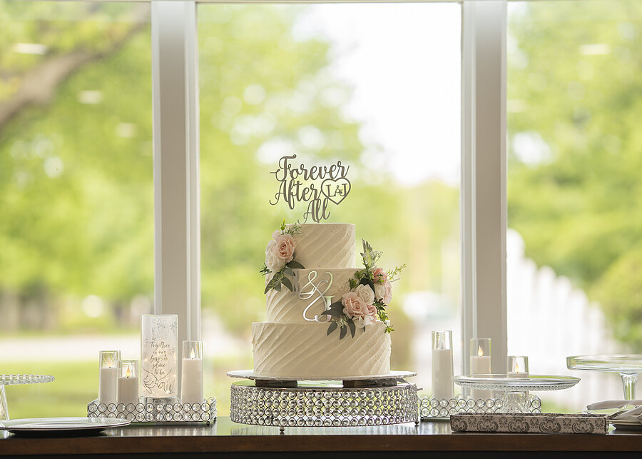 Wedding cake in front of the hall windows