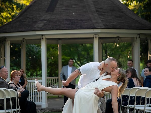 Bride and groom kiss at the gazebo, Chef's Event Center near Rochester, NY