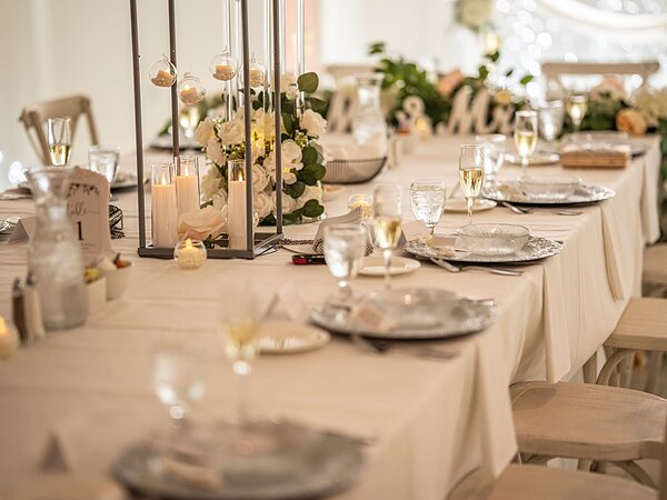 Reception tables set with candles and florals, Chef's Event Center near Rochester, NY
