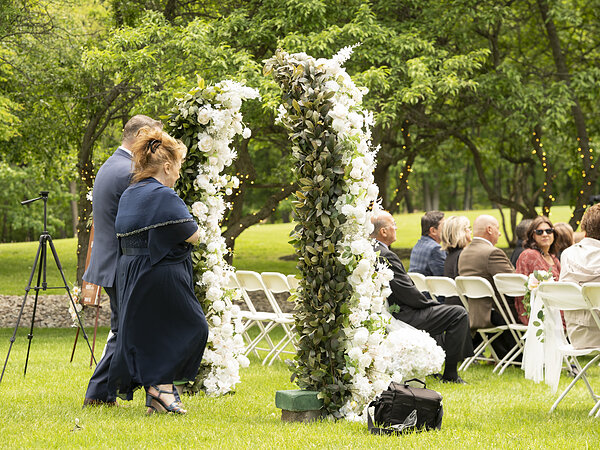 Setting up the floral arch before a ceremony, Chef's Event Center near Rochester, NY