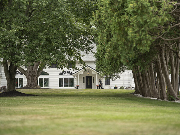 The house and lawn under the trees, Chef's Event Center near Rochester, NY