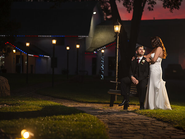 A couple under the string lights at night, Chef's Event Center near Rochester, NY